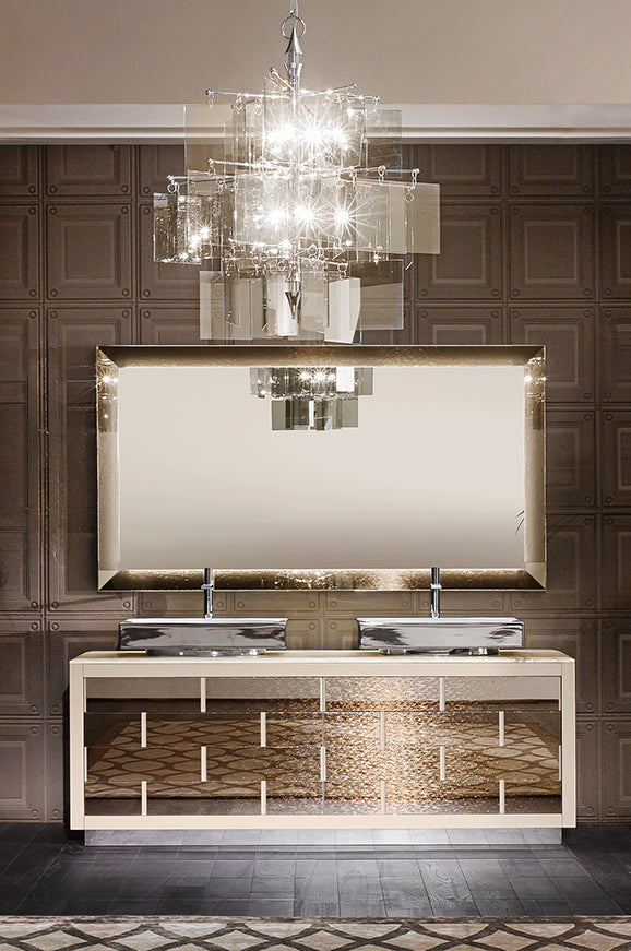 Ritz bathroom set with dark natural stone, light frame and large illuminated mirror.