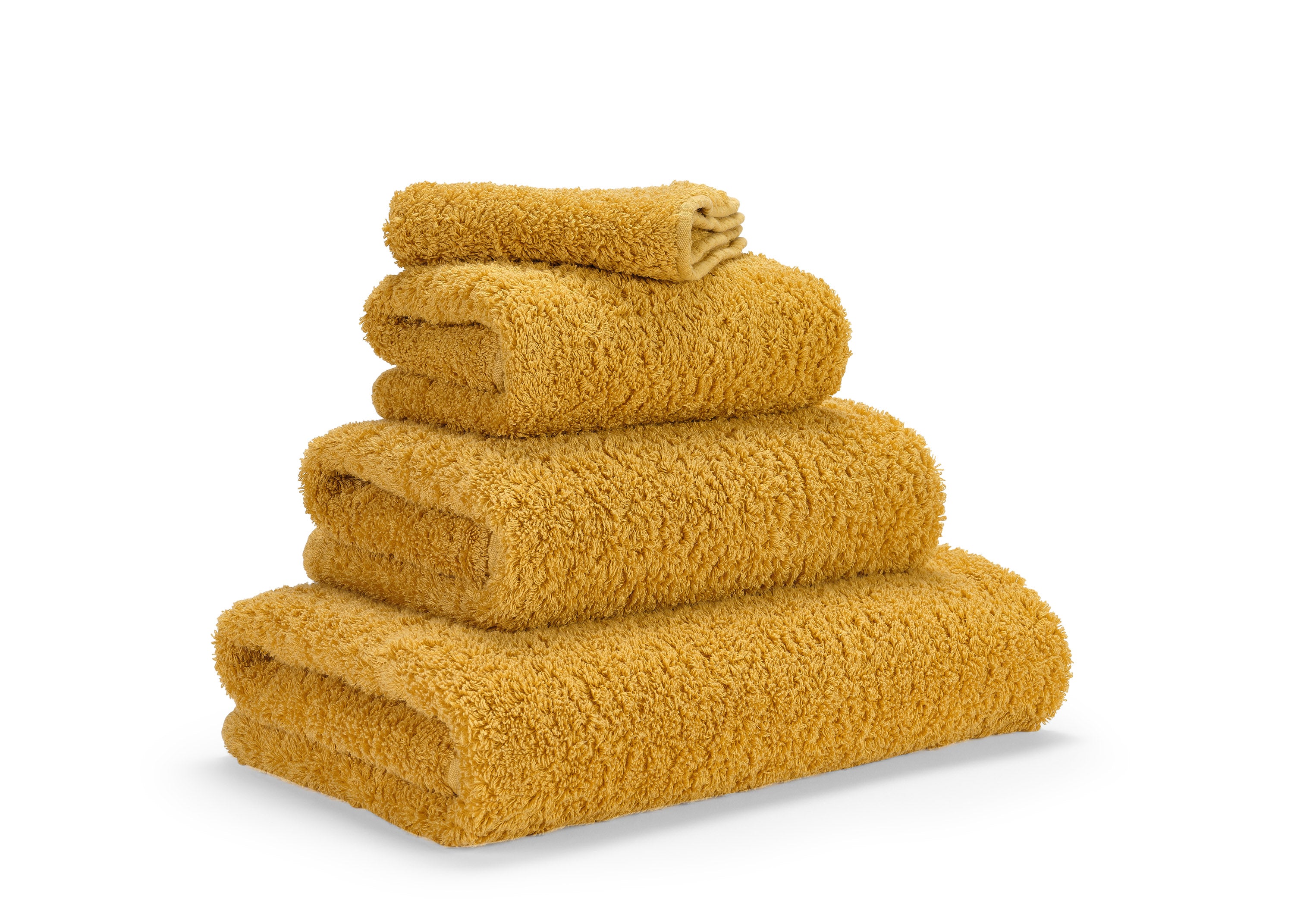 Premium towels in Egyptian Giza 70 cotton in Gold – luxurious bathroom textile by Tiamont, matching refined bathroom furniture and stylish interiors.